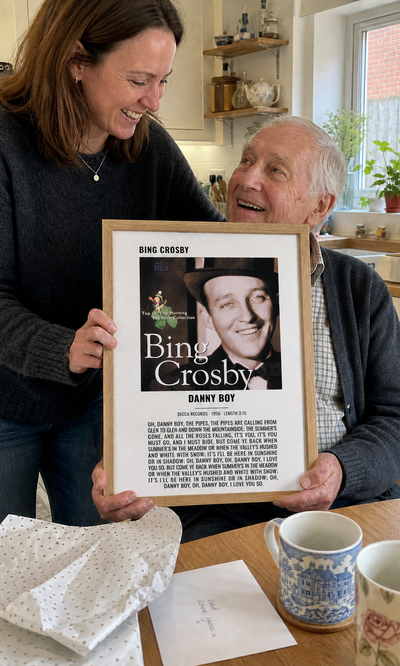 Father receiving a personalised Danny Boy album artwork lyrics print