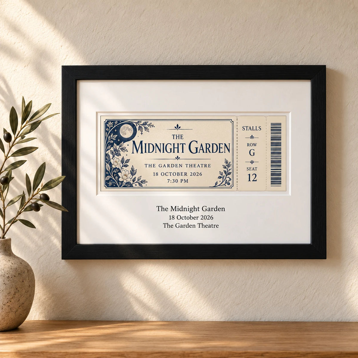 A theatre event ticket in a black landscape frame with the matching show, date and theatre printed on the white mount below
