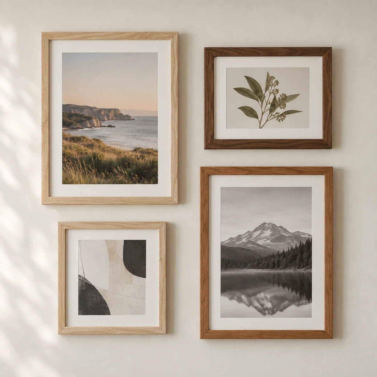 Four solid wood picture frames in pale oak and dark walnut finishes