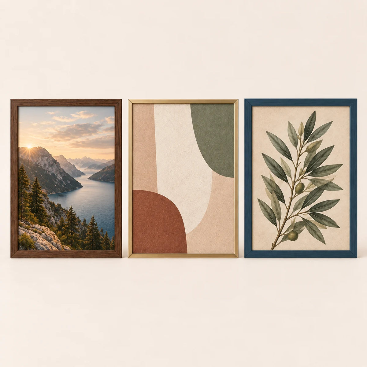 Three 14 by 17 inch picture frames in walnut, champagne brass and slate blue finishes with varied artwork