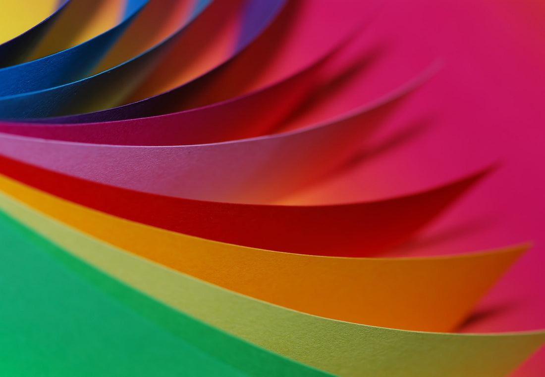 Curved sheets of brightly coloured paper