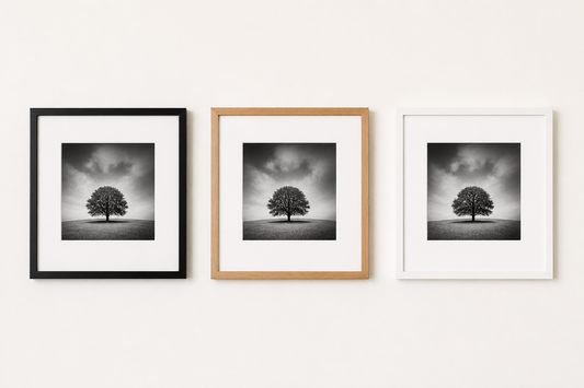 Black and white photographs shown in black white and wood frames