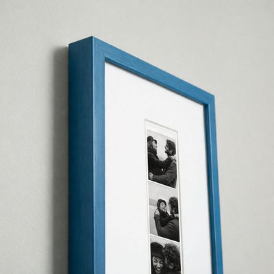 Photo strip in a blue wood frame