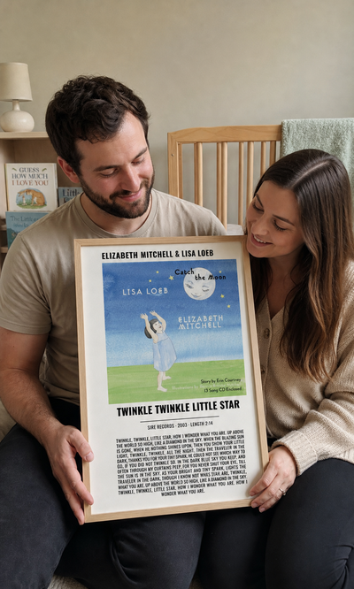 New parents holding a personalised Twinkle Twinkle Little Star album artwork lyrics print
