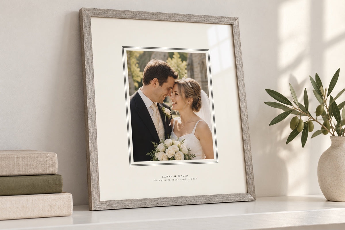 Silver-tone frame with a fine double line around the photo and the names printed on the mat
