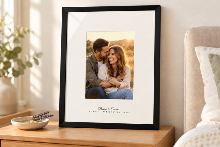 Framed engagement photograph with the couple's names printed on the mat