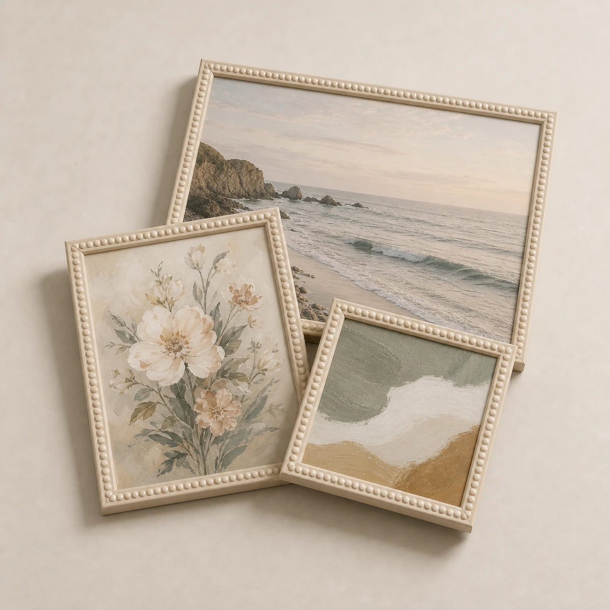 A collection of cream bobbin picture frames lying flat with varied edge-to-edge artwork