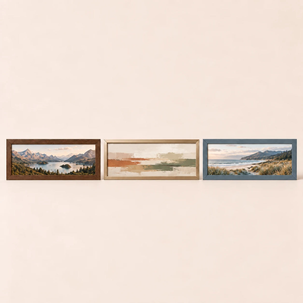 Three 39 by 13 inch picture frames in walnut, champagne brass and slate blue finishes with varied artwork