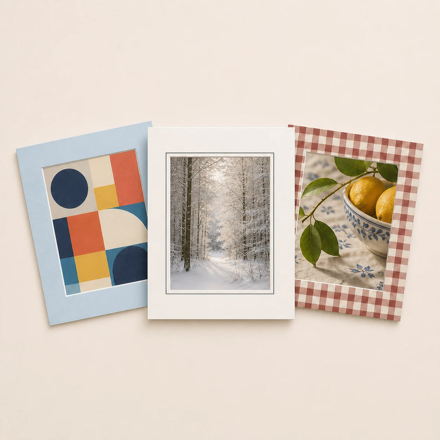 Three 11 by 14 inch picture mats for 8 by 10 inch prints holding varied artwork