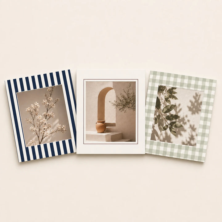 Three 8 by 10 inch picture mats in plain and patterned finishes holding varied artwork