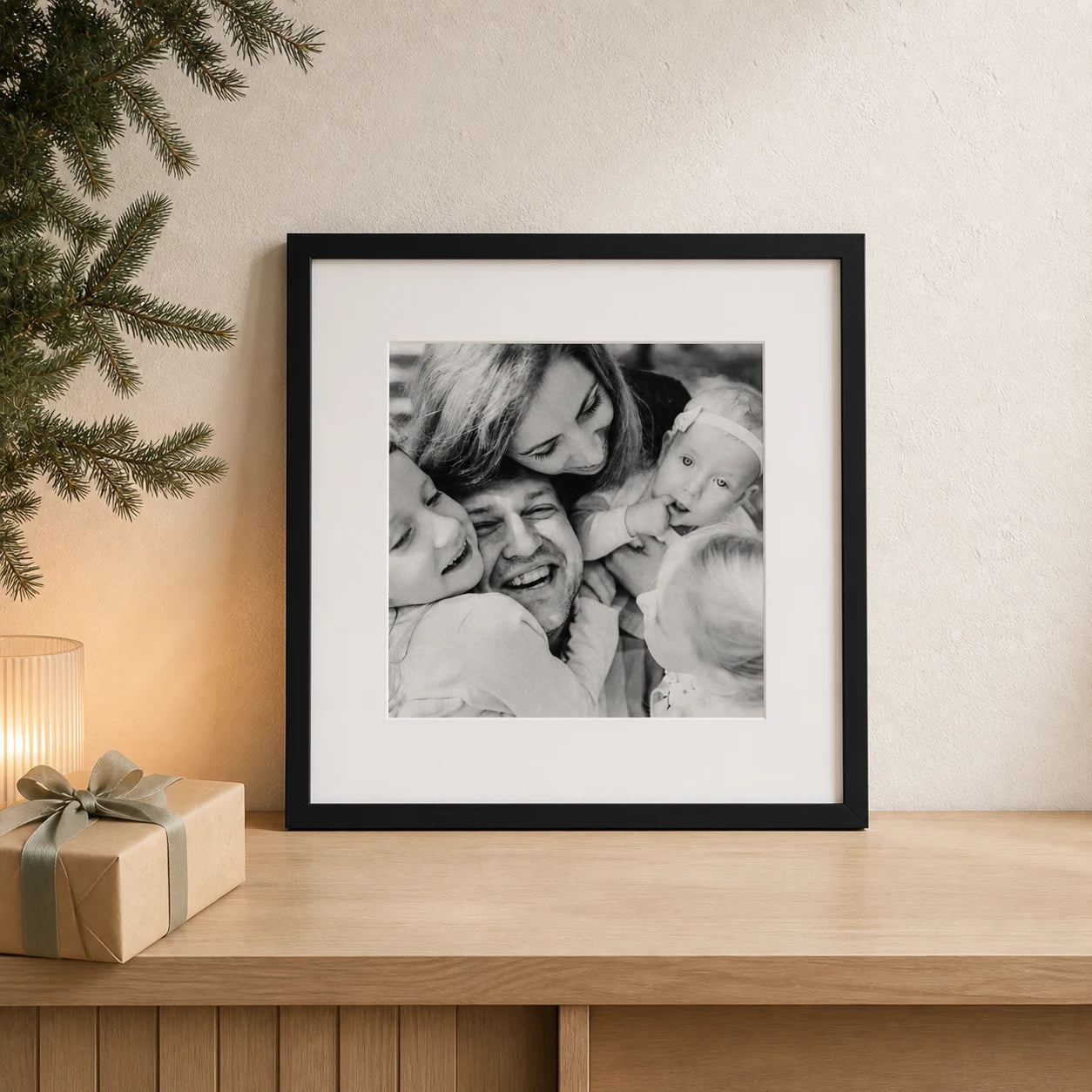 A personalised framed family photograph displayed as a Christmas gift