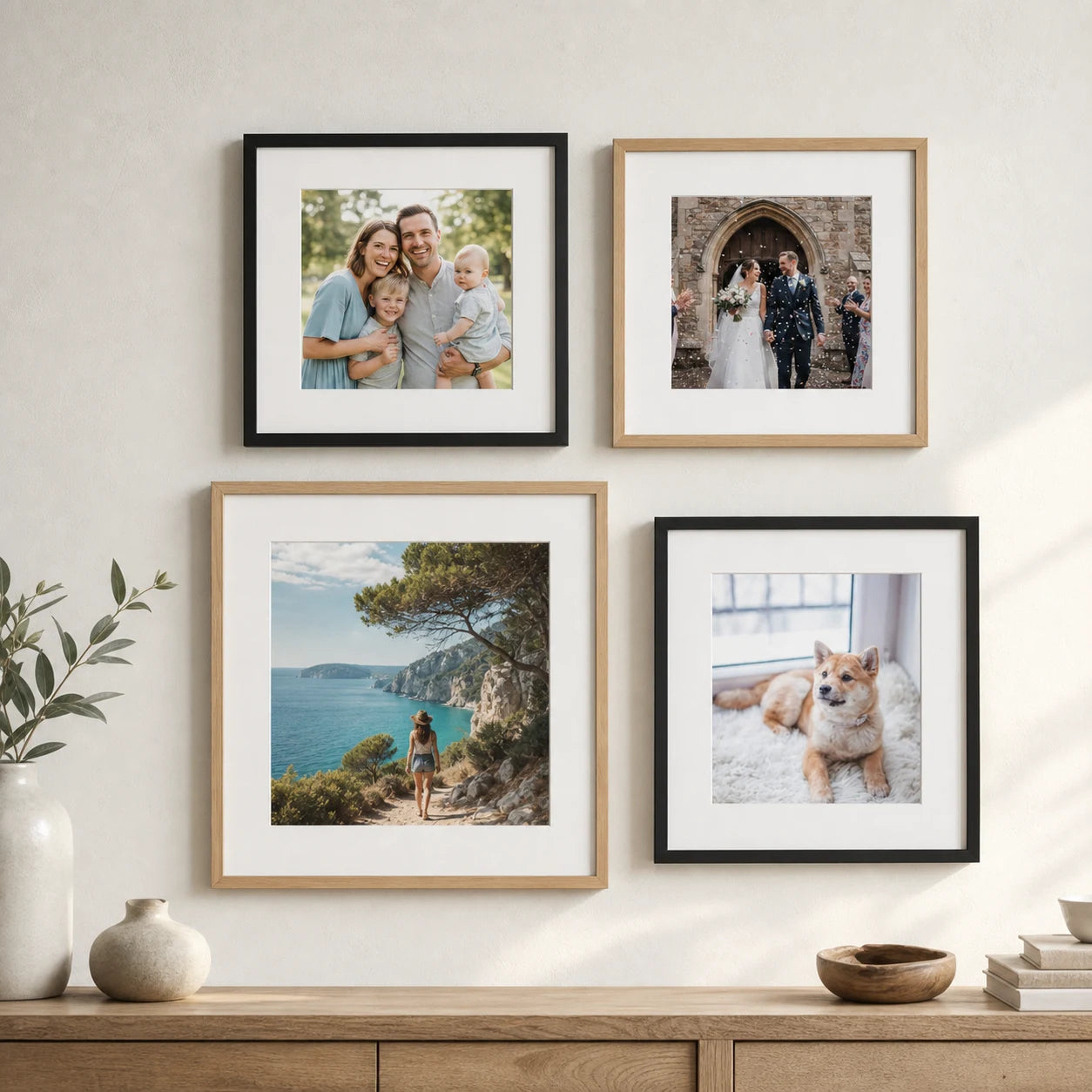 A gallery wall of framed family, wedding, travel and pet photographs